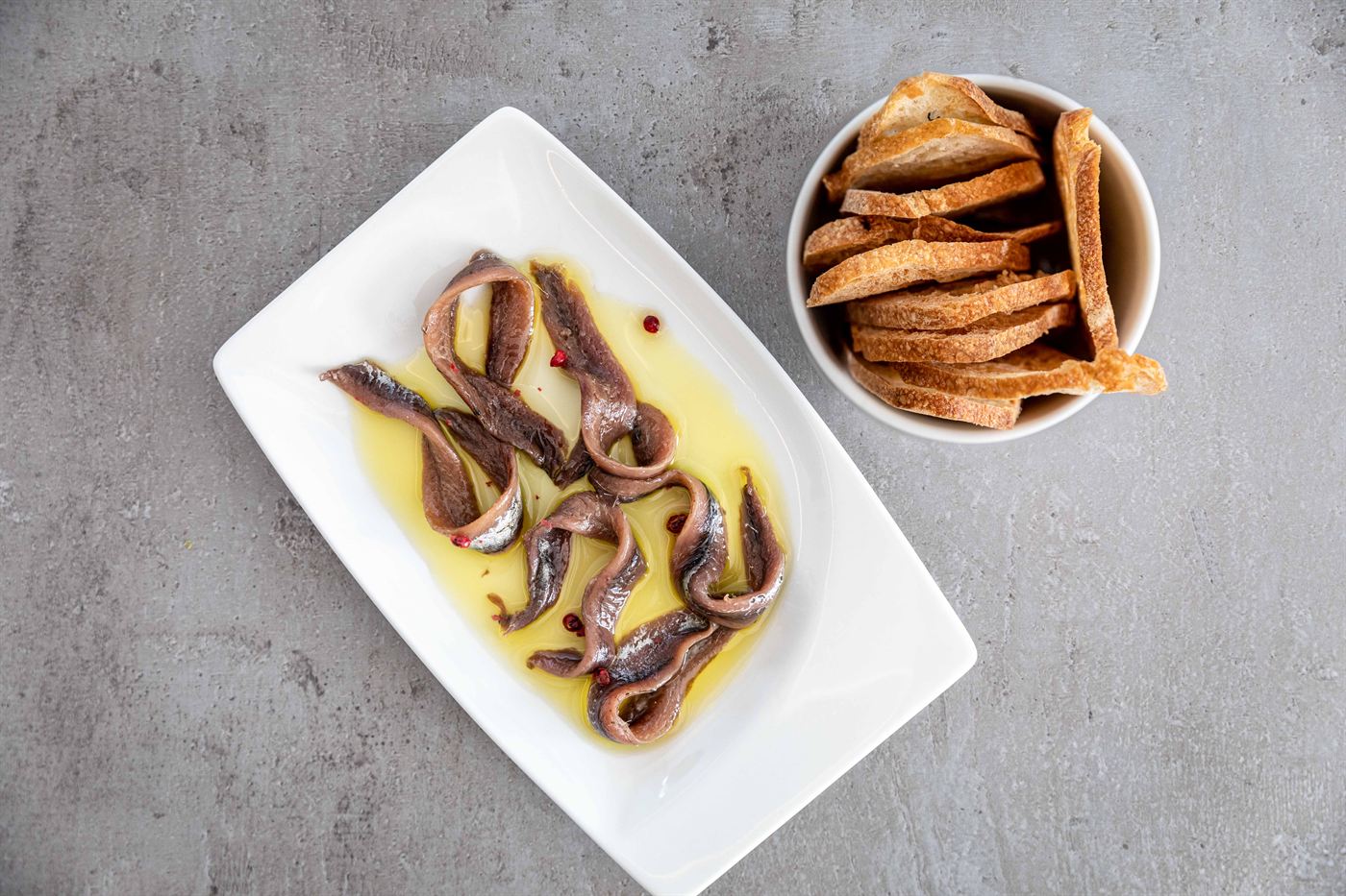 Anchovy fillets in olive oil, with toasted bread