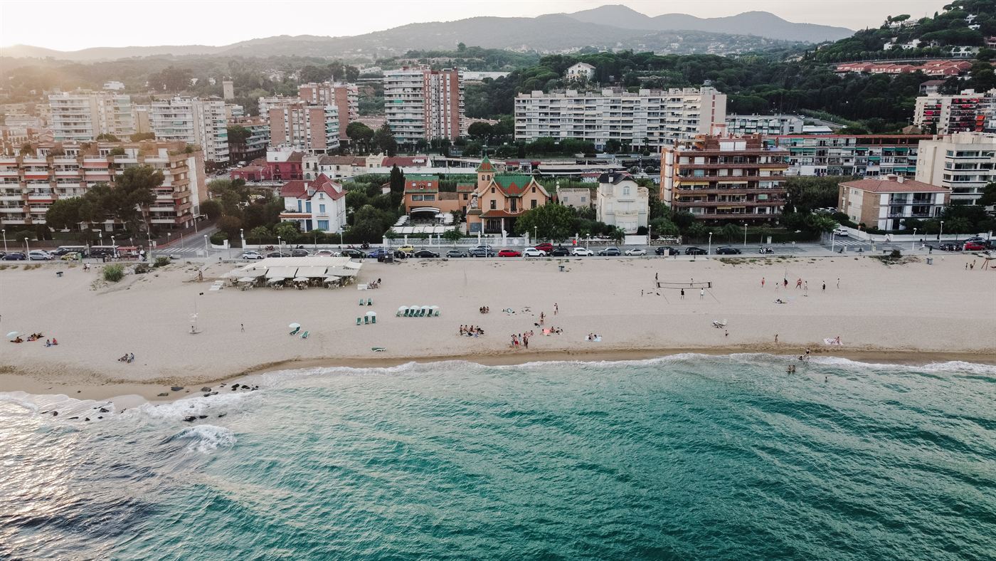 Aerial view of the Maresme coastline, the beach and the town behind it
