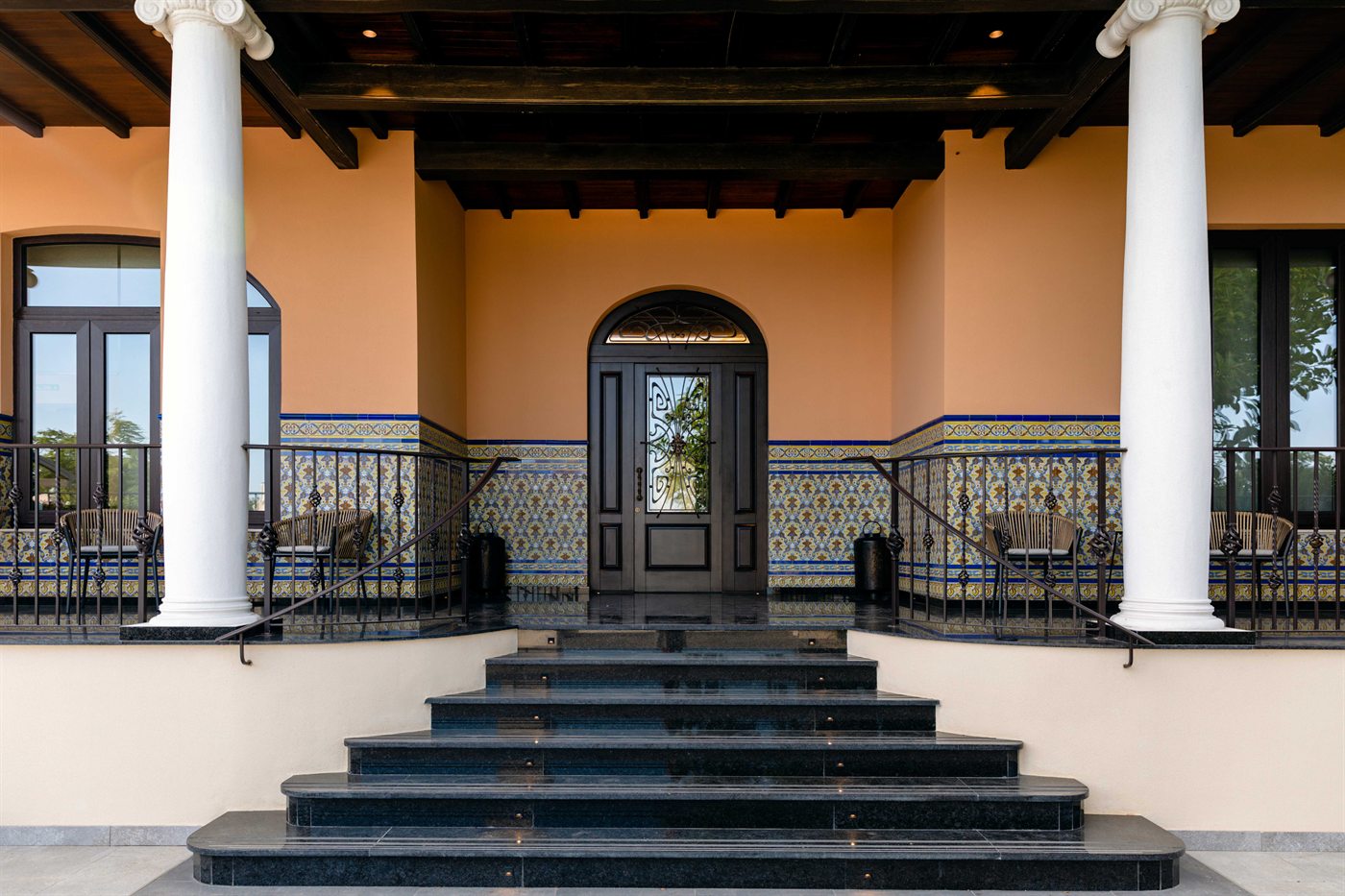 The front entrance, columns and tiled steps