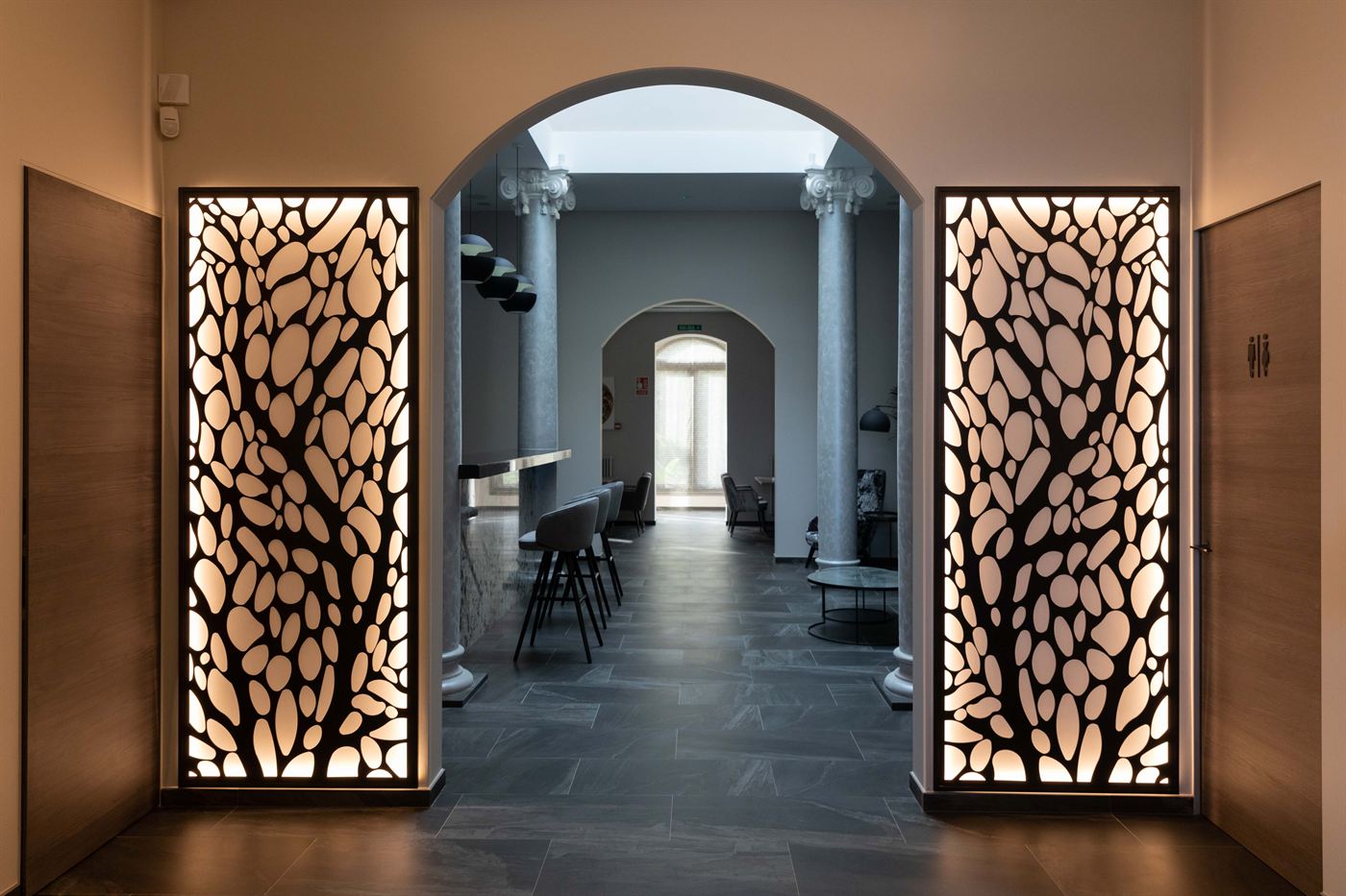 A corridor inside the house, screened in gold fretwork