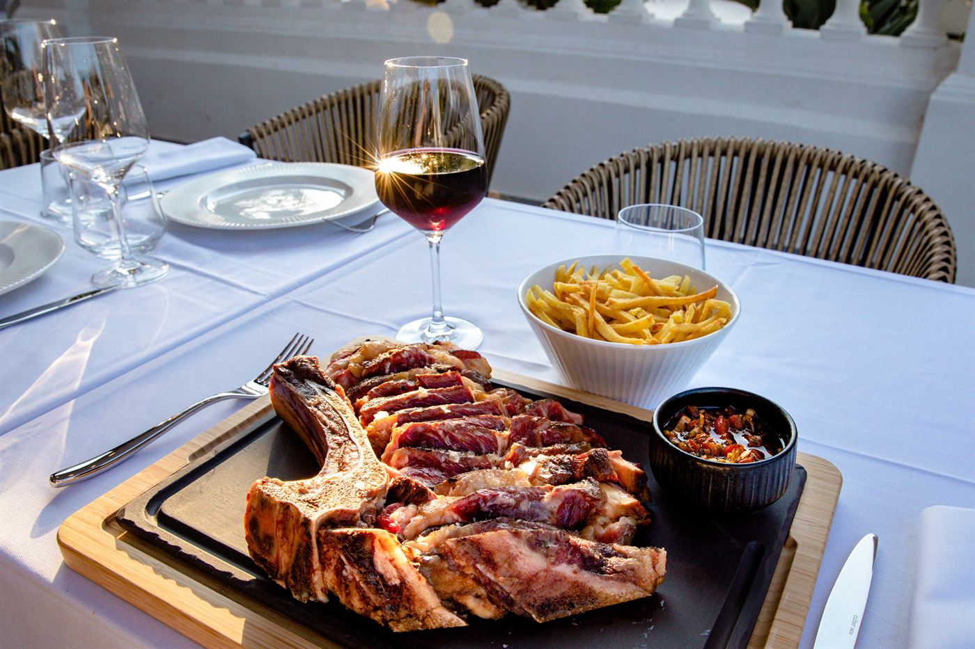 A grilled chop served on the terrace