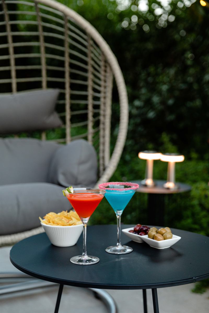 Terrace tables set with drinks for a celebration