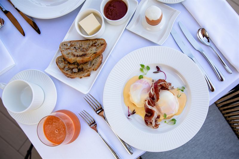 A breakfast spread laid out on the terrace